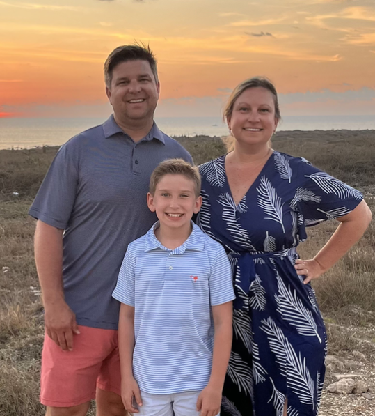 Todd Smith, his wife Mary and their son Cole at sunset